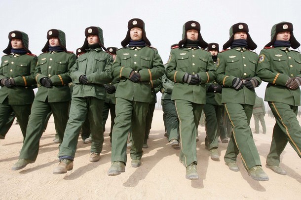 Paramilitary recruits during a training break at an army base in Shenyang, Liaoning province